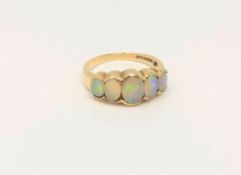 A 9ct gold five stone opal ring, size N CONDITION REPORT: 3.