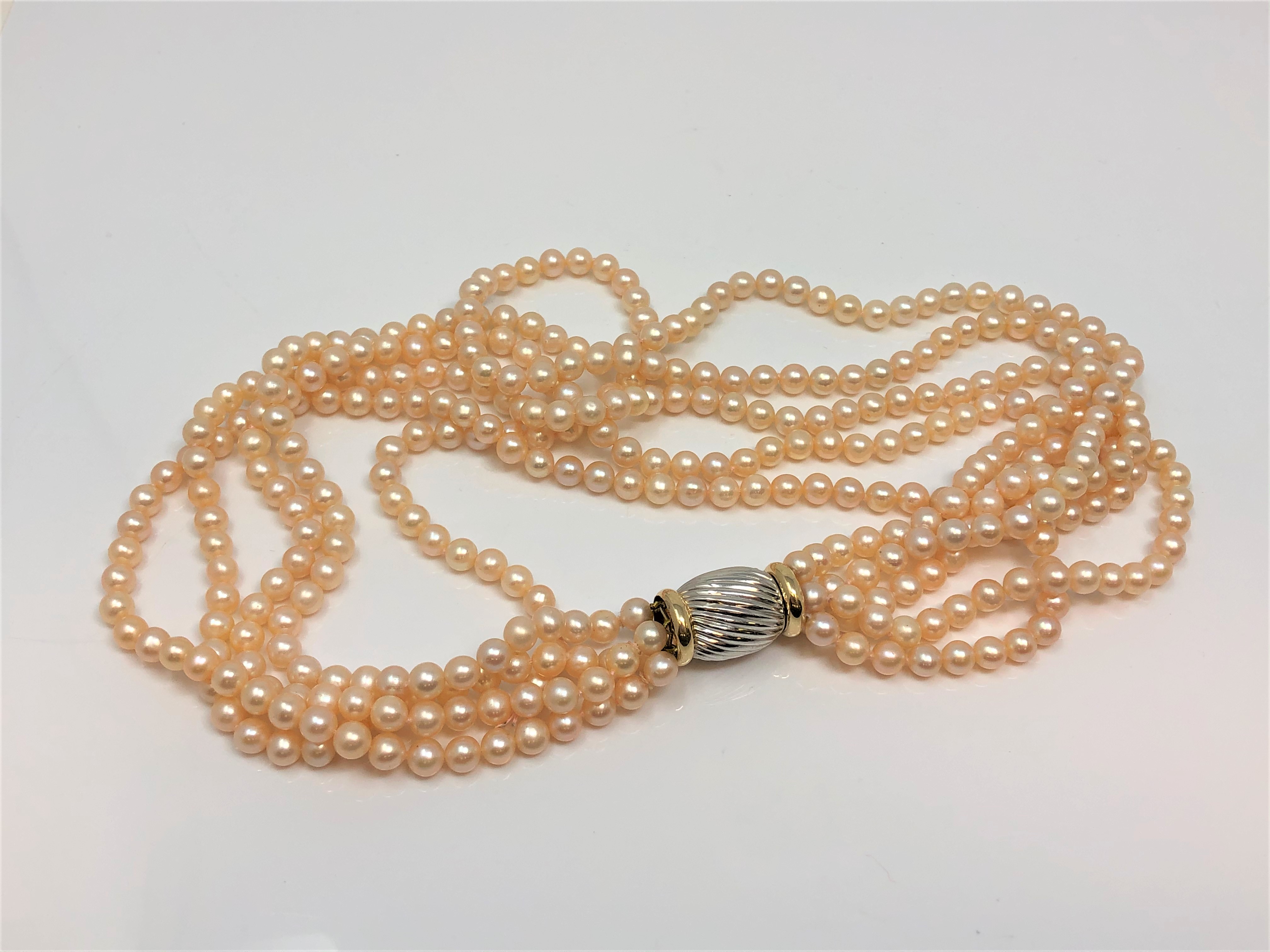 A good quality 15 inch five strand pearl necklace on two tone 14ct gold catch