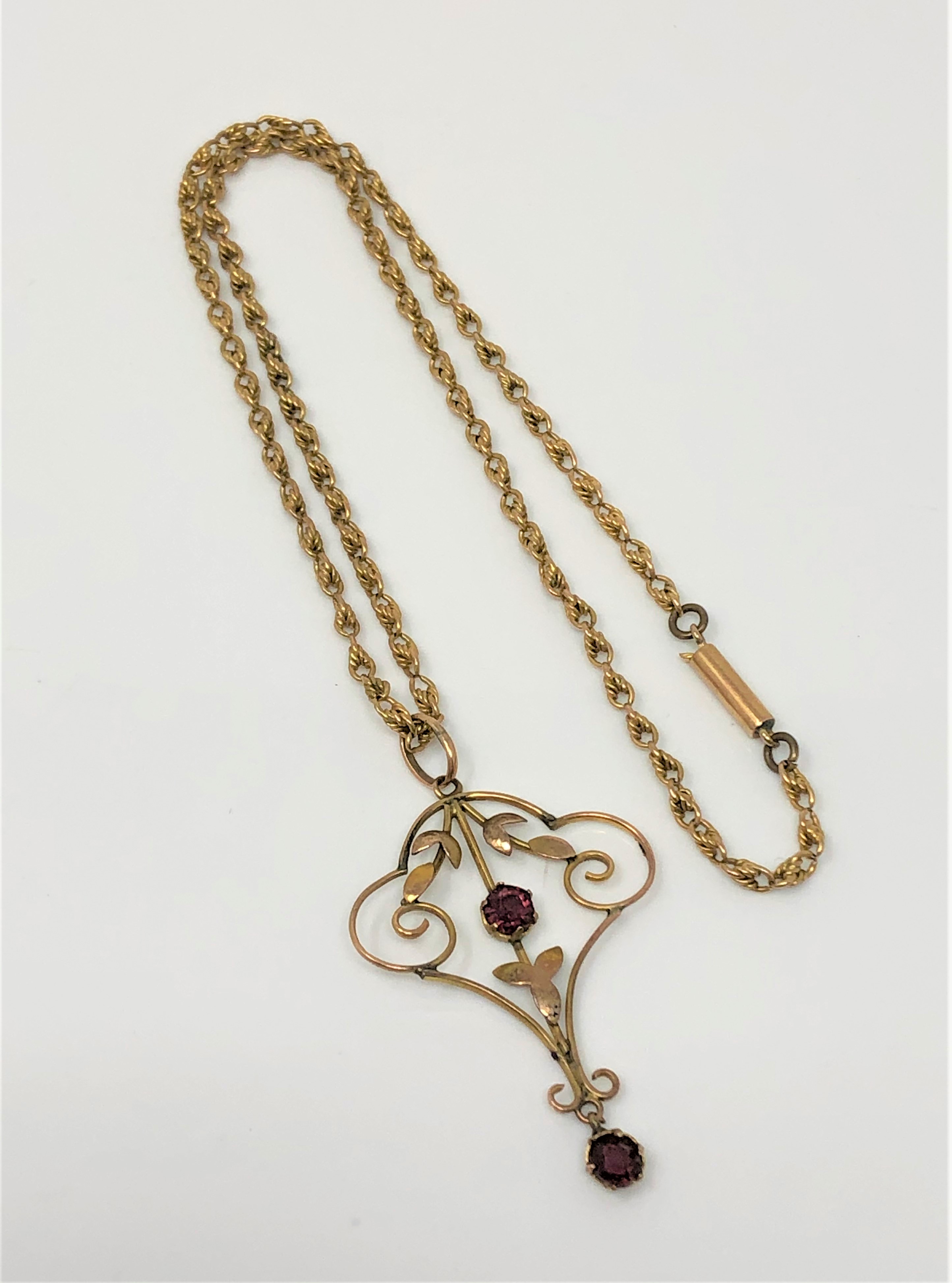 An Edwardian 9ct gold amethyst set pendant on chain CONDITION REPORT: 6.