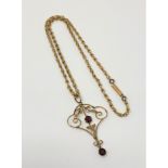 An Edwardian 9ct gold amethyst set pendant on chain CONDITION REPORT: 6.