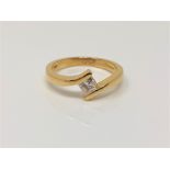 An 18ct gold princess cut solitaire diamond ring, size M CONDITION REPORT: 3.