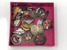 A collection of enamelled badges,