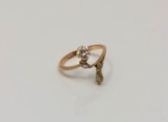 A gold diamond set ring, the principal stone weighing approximately 0.