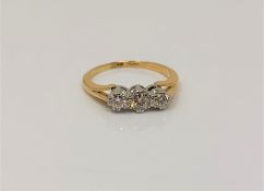 An antique 18ct gold platinum three stone diamond ring, size I CONDITION REPORT: 2.