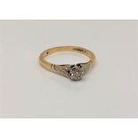 An 18ct gold and platinum solitaire diamond ring, approx 0.