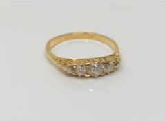 An antique gold five stone old-cut diamond ring,