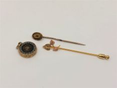 An 18ct gold sapphire and diamond stick pin,