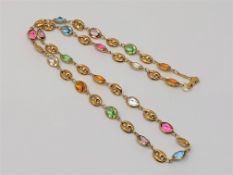An 18ct gold multi-gem set necklace, length 48cm CONDITION REPORT: 12.