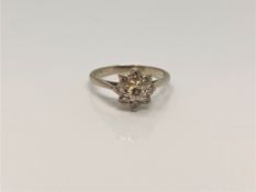 An 18ct white gold diamond cluster ring, size N CONDITION REPORT: 2.
