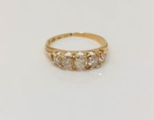 An 18ct gold five stone old cut diamond ring, size J CONDITION REPORT: 2.