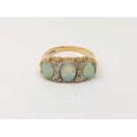 A 9ct gold opal and diamond ring (one opal chipped), size N CONDITION REPORT: 4.