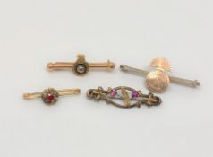 A silver Northumberland Fusiliers bar brooch and three other gold brooches CONDITION