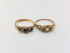 Two gold rings set with agate,