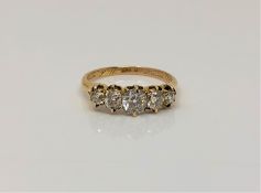 A fine Victorian 18ct gold ring dated 1888 to shank, set with five old cut diamonds,