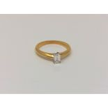 An 18ct gold emerald cut diamond solitaire ring, approx. 0.