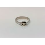 An 18ct white gold princess cut solitaire diamond ring, size M CONDITION REPORT: 2.