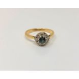 An 18ct gold sapphire and diamond cluster ring, size R CONDITION REPORT: 3.