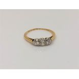 An antique 18ct gold three stone diamond ring, approx. 0.