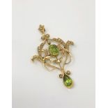 An Edwardian 15ct gold peridot and seed pearl pendant,