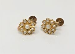 A pair of antique 9ct gold pearl cluster earrings CONDITION REPORT: 2.