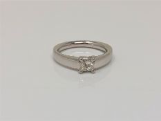 An 18ct white gold princess cut solitaire diamond ring, approximately 0.