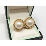 A pair of 18ct gold mabe pearl earrings.