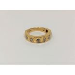 An 18ct gold diamond set half eternity ring, approx. 0.