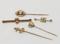 A group of gold brooches including Grenadier brooch,