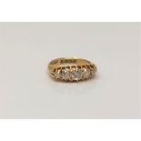 An 18ct gold five stone diamond ring, the total diamond weight approximately 1.