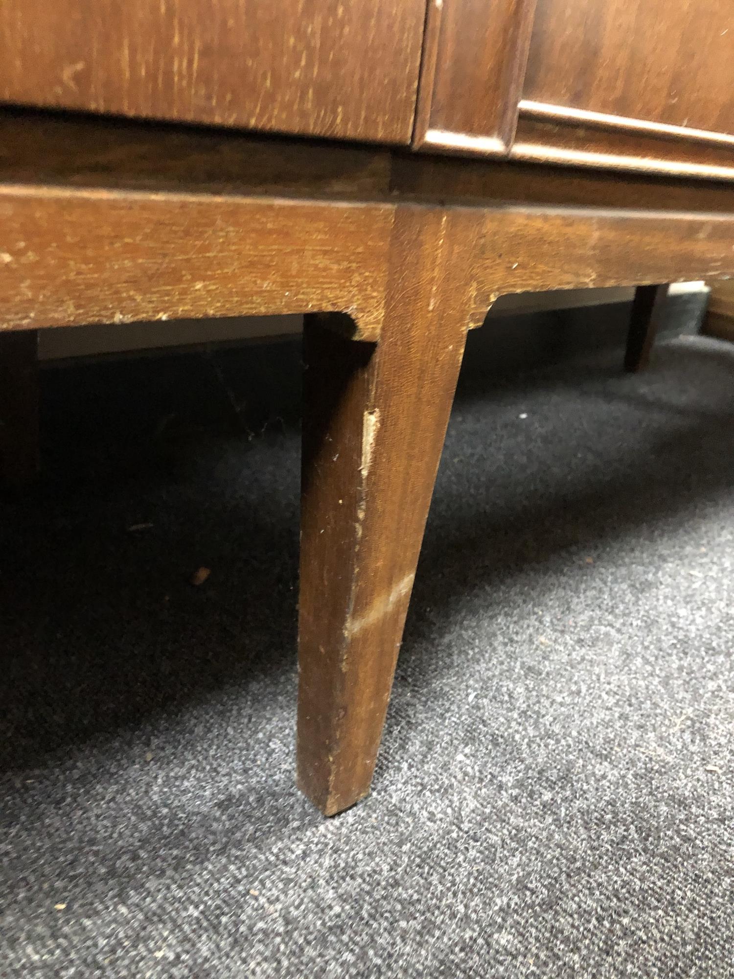 A mid 20th century teak four door sideboard on raised legs - Image 6 of 6