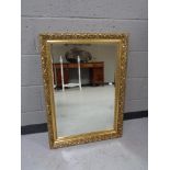 A gilt framed overmantel mirror