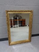 A gilt framed overmantel mirror