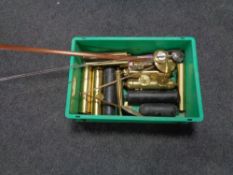 A crate of clock weights and pendulums