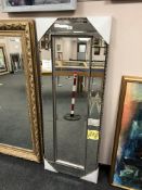 An all glass rectangular mirror