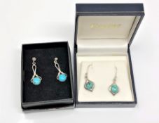 Two pairs of silver and turquoise earrings.
