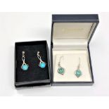 Two pairs of silver and turquoise earrings.