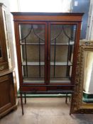 A late Victorian inlaid mahogany double door display cabinet fitted two drawers beneath,