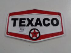 A cast iron plaque - Texaco