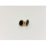 A pair of 9ct gold onyx earrings.