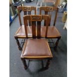 Three Edwardian carved oak dining chairs