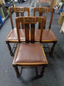 Three Edwardian carved oak dining chairs