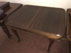 An Edwardian pull out dining table