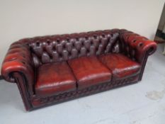 A three seater red button leather Chesterfield club settee CONDITION REPORT:
