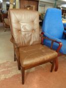 A wood framed high back armchair with a brown buttoned leather cushion