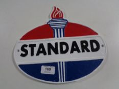 A cast iron plaque - Standard Oil