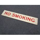 A hand painted wooden sign 'No Smoking'