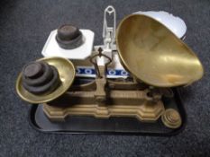 A tray of two sets of vintage scales and weights