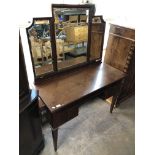 A mahogany dressing table with triple mirror (a/f), 113cm wide by 51cm deep by 151cm high overall.