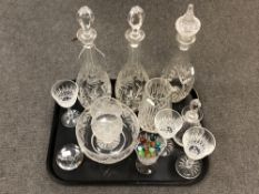 A pair of good quality heavy cut glass decanters, with flower and leaf decoration, with stoppers,