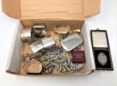 A box of costume jewellery, plated napkin rings,